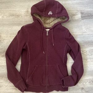 TNA burgundy sweater with the faux fur